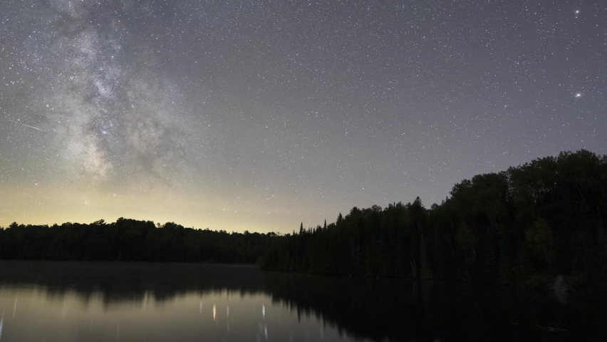 Milky Way Night Sky Astro Time Lapse, Galactic Core And Stars Over Lake