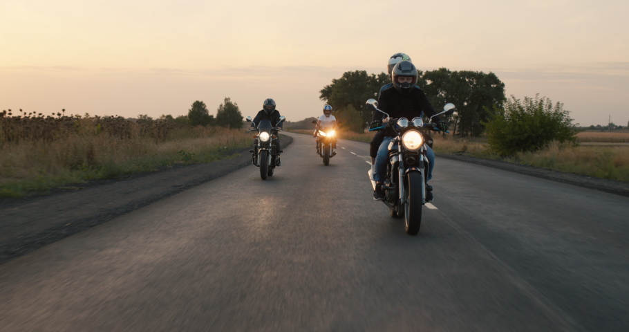 Young bikers ride motorcycles on the highway | Shutterstock HD Video #1060135490