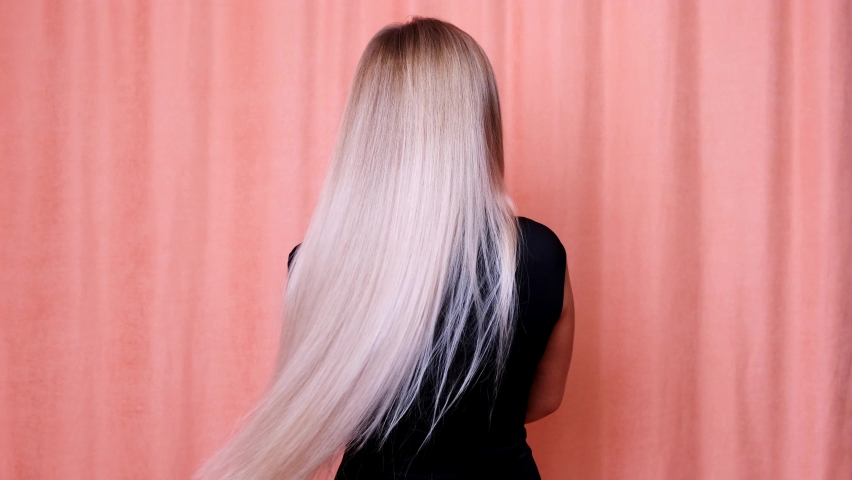 Hair. Beautiful healthy long straight blonde hair close-up. Dyed white blond hair background, coloring, extensions, cure, treatment concept. Haircare. Slow motion 4K UHD video. | Shutterstock HD Video #1060137746