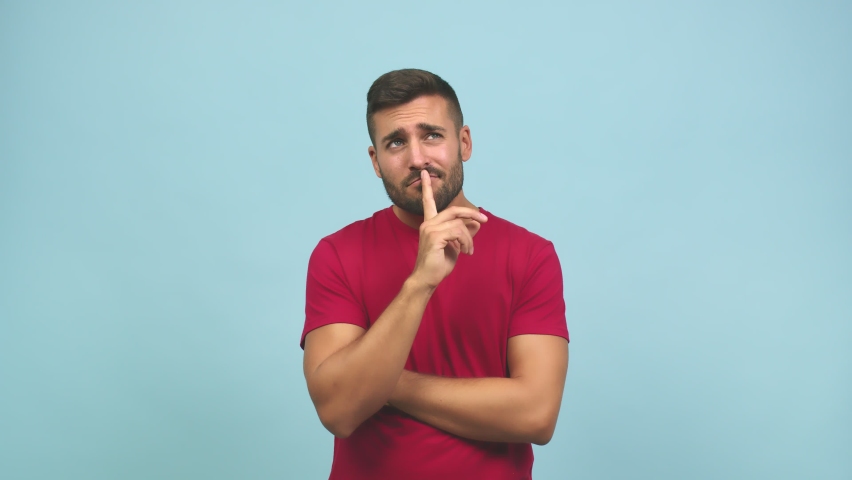 Young caucasian handsome man doubting and confused, thinking of an idea or worried about something | Shutterstock HD Video #1060145438