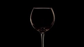 Young red wine pouring into wine glass slow motion close up shot - Powered by Shutterstock - Get 15% off with code: PIKWIZARD15