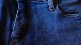 Blue denim jeans close up 4K stock footage. Blue denim Jeans in close up with a sliding camera move.