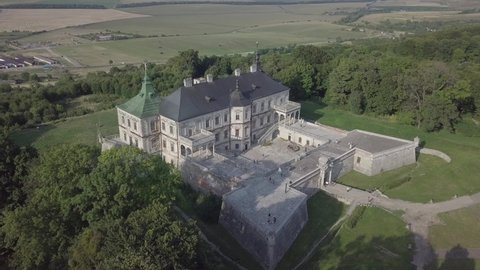 Aerial view to famous ukranian sightseeing old ruined palace castle in Pidhirci was build by Stanislav Koniecpolsk at summer sunny dayi, Lviv region, Ukraine