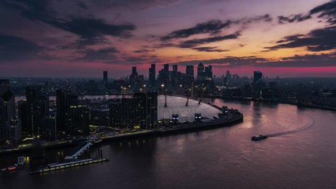 Revealing Aerial View Shot of London UK, entrance to the city, Financial District & City of London, United Kingdom, perfect sunset