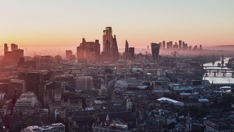 Establishing Aerial View Shot of London UK, London Skyline, St Paul's Cathedral, The City & Thames River, modern & old, United Kingdom, enchanted morning fog