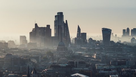 Establishing Aerial View Shot of London UK, London Skyline, St Paul's Cathedral, The City & Thames River, modern & old, United Kingdom, magical morning fog