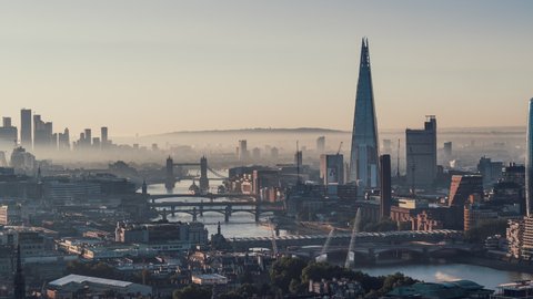 Establishing Aerial View Shot of London UK, London Skyline, St Paul's Cathedral, The City & Thames River, United Kingdom, magical morning light