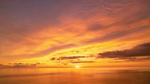 4K Time lapse of Majestic sunset or sunrise landscape Amazing light of nature cloudscape sky and Clouds over sea moving away rolling 4k colorful dark sunset clouds Footage timelapse Beautiful sky