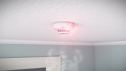 video animation of a smoke detector mounted on the ceiling of an apartment - Detects smoke and triggers alarm