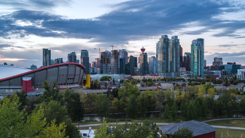 Day to night timelapse view of Calgary skyline showing high rise buildings in the financial district, Calgary, Alberta, Canada, zoom in.  