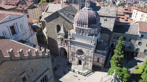 Bergamo, Italy. The old town. Amazing aerial view of the Basilica of Santa Maria Maggiore and the chapel Colleoni. Landscape of the city center and Its landmarks during a wonderful day. 