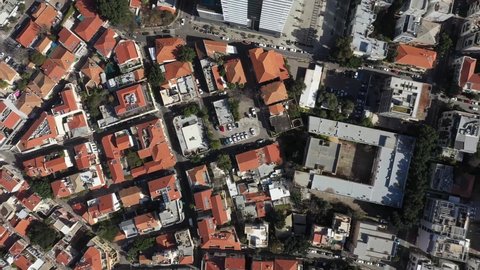 brids eye view of Neve tzedek and Tel Aviv while traffic moves on the streets