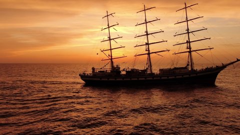 Sunset. Reflection of the sun in the water. Sailing ship in the open ocean. Japan sea. Travel. Freedom.