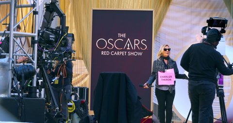 LOS ANGELES, CALIFORNIA, USA - FEBRUARY 7, 2020: Charlize Theron media broadcast crew prepares for Red Carpet Oscar academy award nomination coverage in Los Angeles, California, 4K