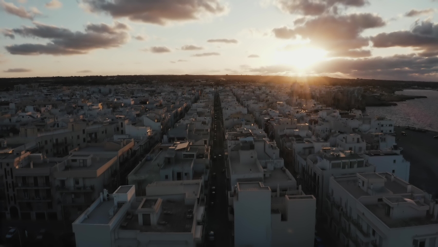 Aerial sunset view of the Polignano a Mare town, Puglia region, Italy, Europe. Superb view of Adriatic sea. Traveling concept background. Turquoise sea water.