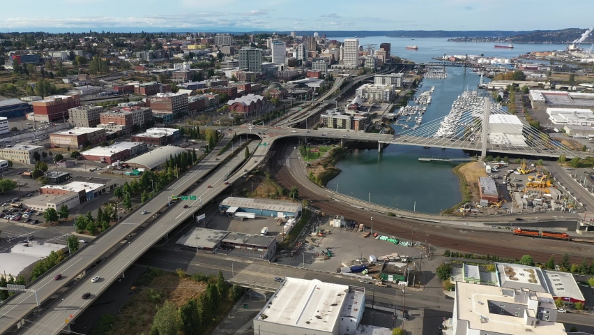 Flyover footage of downtown Tacoma, waterfront by Puget Sound, a large city near Seattle in Western Washington, Pacific Northwest, an administrative and economic center of Pierce County