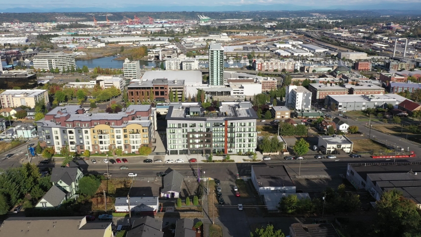 Aerial / drone footage of Tacoma downtown, waterfront by Puget Sound, a large city near Seattle in Western Washington, Pacific Northwest, an administrative and economic center of Pierce County