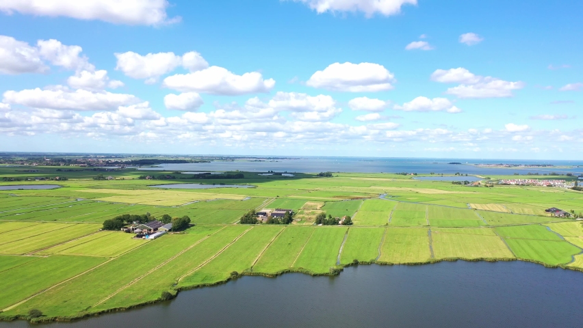 Aerial view over Historic dutch Waterland landscape, typical Dutch landscape, North-Holland, Netherlands Royalty-Free Stock Footage #1060203011