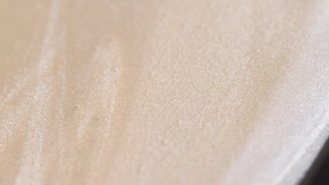 Silky And Glossy Cosmetic Cream Fluids Flowing In Slow Motion. - macro shot