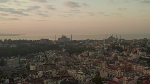 Two Mosques on a Hill at Hazy Sunrise in Istanbul, Aerial forward