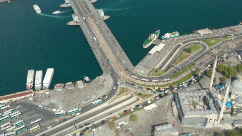 Traffic Jam with Yellow Taxi Cabs in Istanbul at Galata Bridge Bosphorus and New Mosque, Aerial Drone View from above