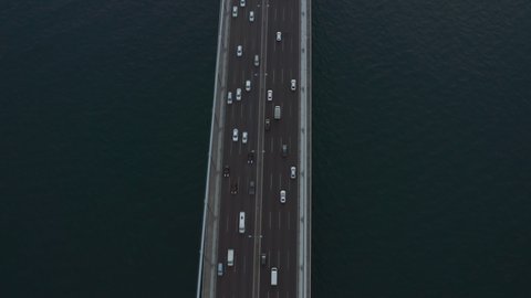 Car Traffic on Bridge going into the City in Istanbul, Turkey, Aerial Birds Eye tilt up view