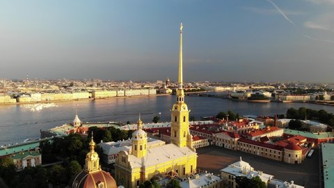 Peter and Paul Fortress in Saint-Petersburg. Sight on summer sunset. Very nice. Aerial view. Hare Island. Flying over. Drone is rotating right. Saints Peter and Paul Cathedral