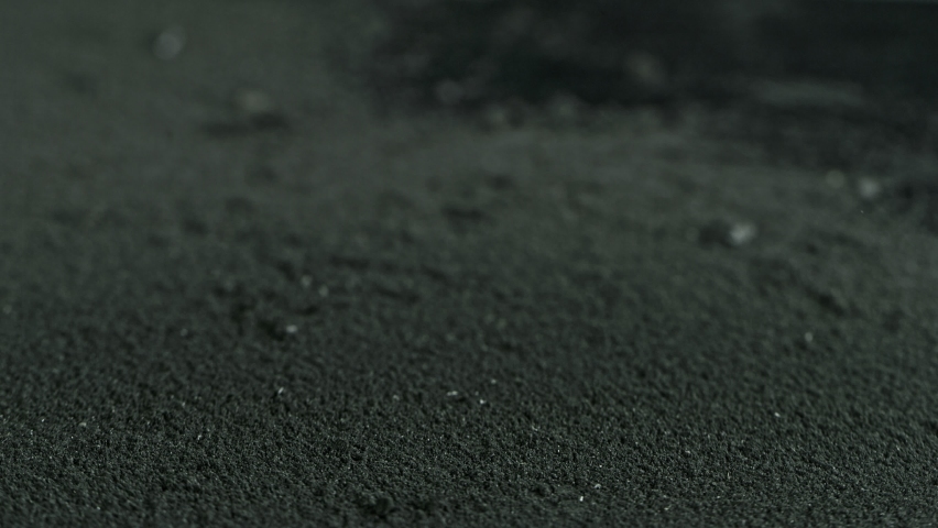 Super Slow Motion Shot of Coal Falling into Black Powder at 1000 fps. Royalty-Free Stock Footage #1060214093