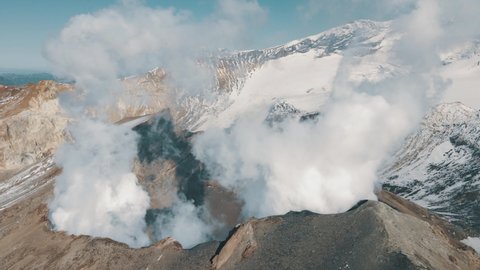 Birds View Smoking Active Crater of Volcano. Volcanic Panorama Landscape Terrain Inside Crater. Landmark Nature Travel Place Drone Footage Foggy Magnificent Mountain Steaming. Epic Shot Wildlife 4k