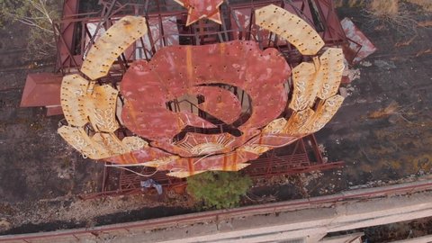 Aerial view over the sign of USSR on the roof in city of Pripyat near the Chernobyl nuclear power plant in Chernobyl exclusion zone. Ukraine. Ghost city after disaster