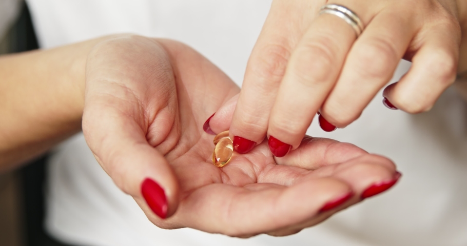 Woman Holding Pills On Hand 스톡 동영상 비디오(100% 로열티 프리) 1060226330 | Shutterstock