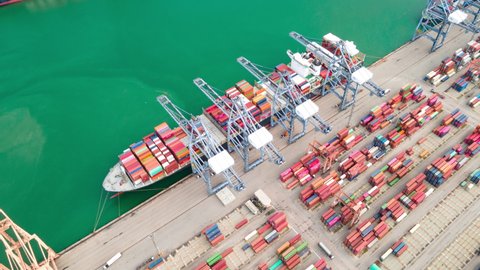 Time lapse Container , container ship in export and import business and logistics. Shipping cargo to harbor by crane. Water transport International. Aerial view and top view.