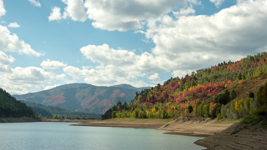 Time lapse during Fall color around Palisades Reservoir in Idaho as clouds move through the sky.