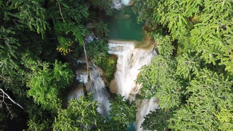 Breathtaking Laos Nature and Waterfall in The Middle of Jungle, Cinematic Aerial. Kuang Si Falls, Luang Prabang