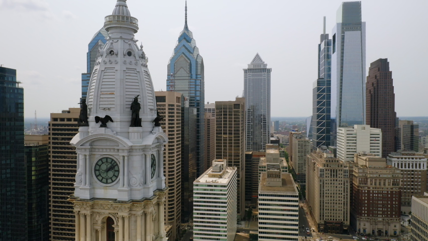 Close up aerial view of Philadelphia center city skyline and city hall tower featuring the William Penn statue Royalty-Free Stock Footage #1060230212