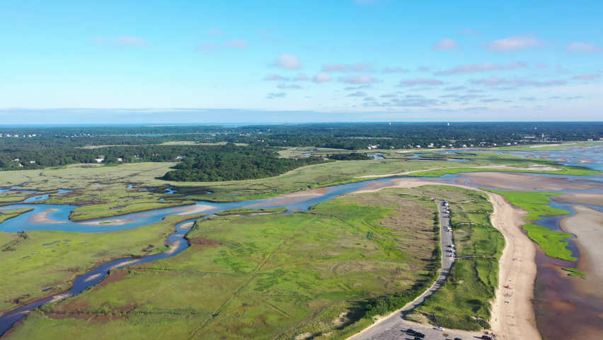 Cape Cod Aerial Drone Footage of Marsh and Beach at Low Tide with People and Tall Green Grass