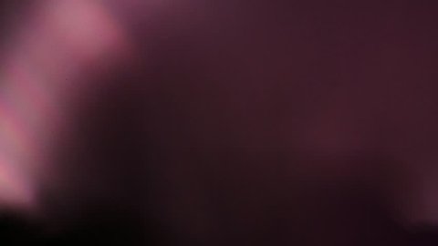 Subtle light leak on black background, moving lens flare. Red - orange - blue pastel colors. Overlay on top of footage for vintage super 8 film effect.  - Βίντεο στοκ