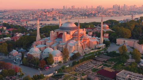 Istanbul, Hagia Sophia Grand Mosque (Ayasofya) with a Golden Horn on the background at sunset. Aerial all-round view