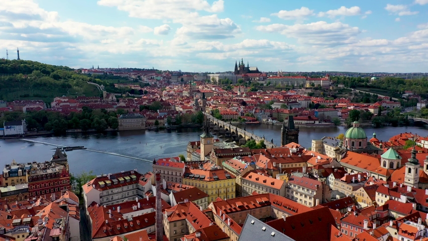 Prague scenic spring aerial view of the Prague Old Town pier architecture and Charles Bridge over Vltava river in Prague, Czechia. Old Town of Prague, Czech Republic. | Shutterstock HD Video #1060242896