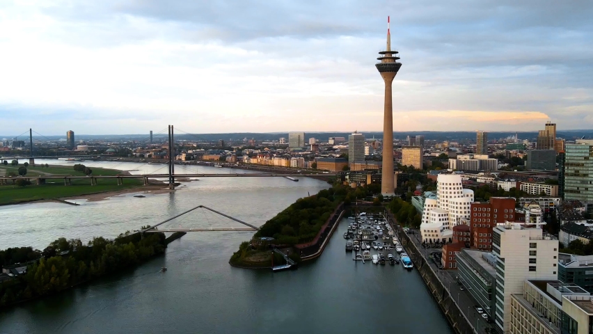Düsseldorf, Germany - drone hyperlapse shot of the media harbour/ cityscape while sunset. Royalty-Free Stock Footage #1060244072