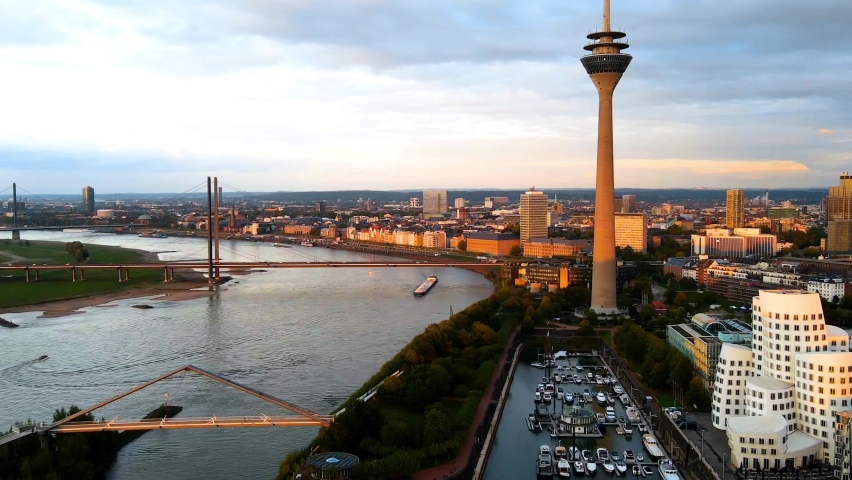 Düsseldorf, Germany - drone hyperlapse shot of the media harbour/ cityscape while sunset. Royalty-Free Stock Footage #1060244072