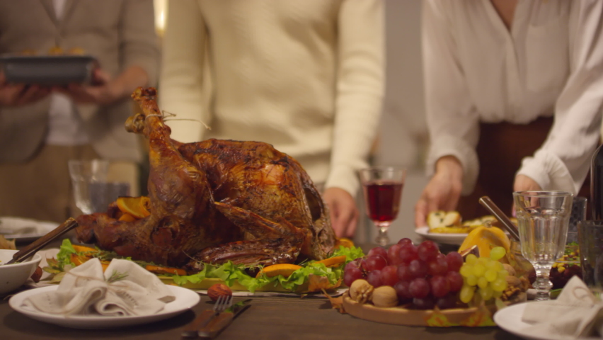 Modern big family setting dining table with delicious food for Thanksgiving celebration