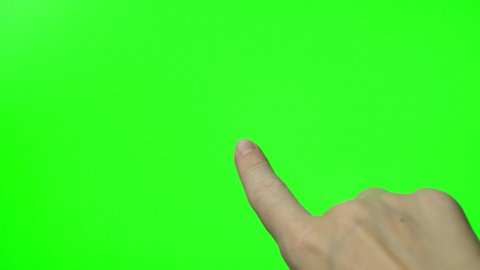 Finger Touches the Green Screen Chromokey, Macro, Close-Up. Finger and Green Chromokey Screen. Technology.