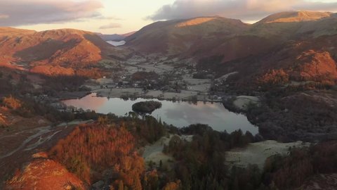 An aerial view over Grasmere in the Lake District at sunrise