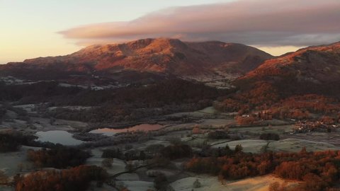 An aerial view over Loughrigg in the Lake District at sunrise