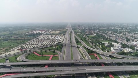 Amazing drone shot of Peshawar Mor interchange in Islamabad Capital of Pakistan busy traffic roads and bridges