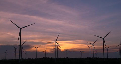 The silhouette of the Wind turbines and the beautiful sunset,Windmills and Landscapes, Renewable Energy Concept