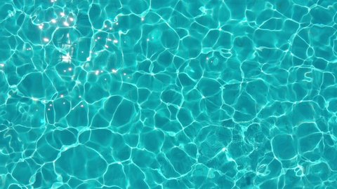 aerial view of  blue and transparent water of the swimming pool 
