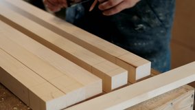 Carpenter makes measurements. A man works with a tree. The carpenter takes measurements. Woodworking and traditional carpentry, craftsmanship, handwork concept. - Powered by Shutterstock - Get 15% off with code: PIKWIZARD15