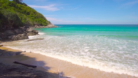 Phuket beach sea. Landscape view of beach sea and sand in summer sun. Beach space area background. At Naiharn beach, Phuket, Thailand. On September 2020. 4K UHD Videoclip 3840x2160P. 29.97.FPS Vídeo Stock